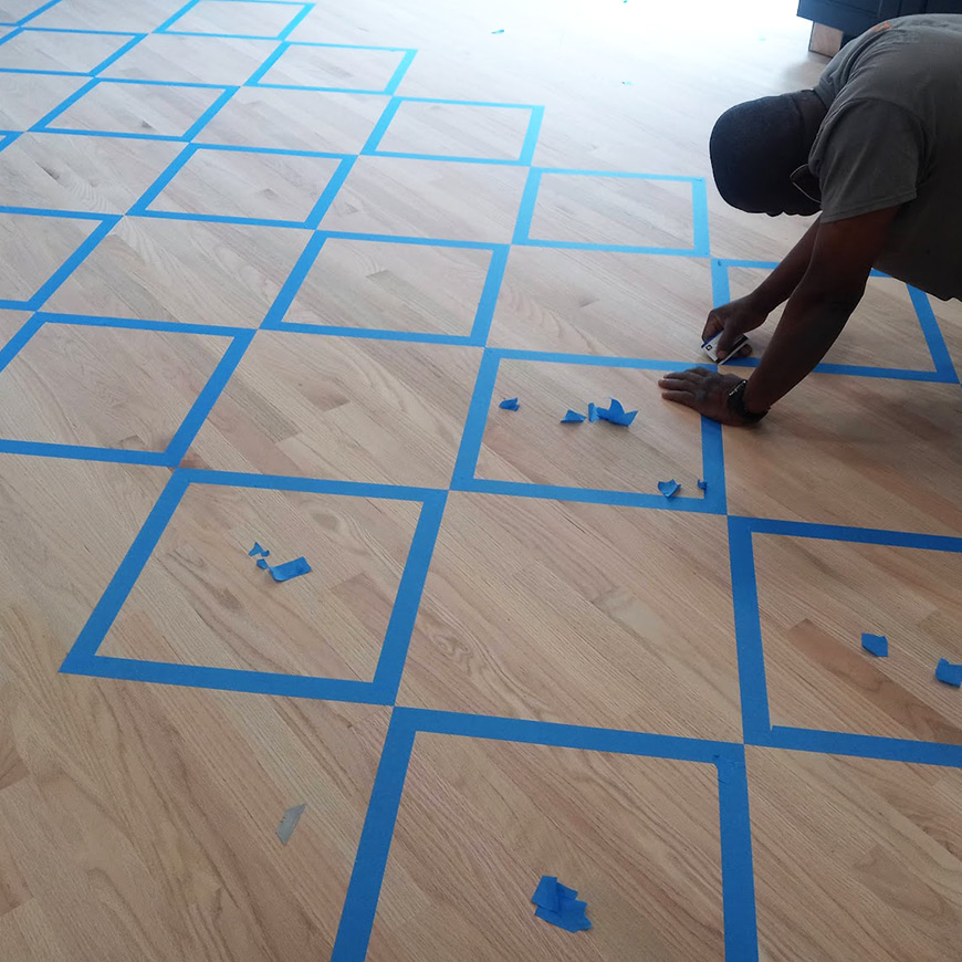 taping squares on hardwood floor